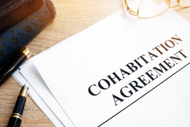 istock Cohabitation Agreement and books on a table. 917590664