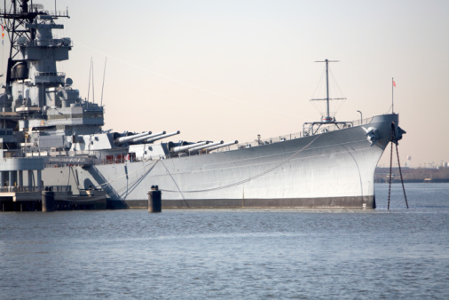 Portsmouth, England. February 12th 2024. HMS Prince of Wales exiting Portsmouth harbour past the round tower and hundreds of spectators.