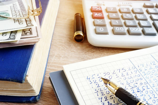 istock Accounting book, currency and calculator. Home finances. 917594036