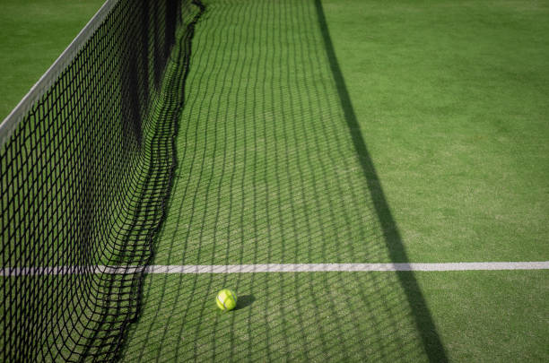 Paddle tennis court and net with a ball stock photo