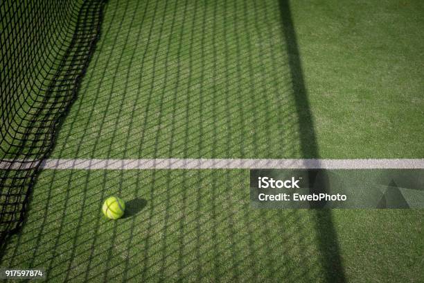 Paddle Tennis Court And Net With A Ball Stock Photo - Download Image Now - Tennis, Grass, Sports Court