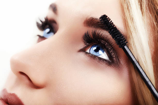 istock Woman Make-up Applying closeup. Eyeliner. Cosmetic Eyeshadows 917598294