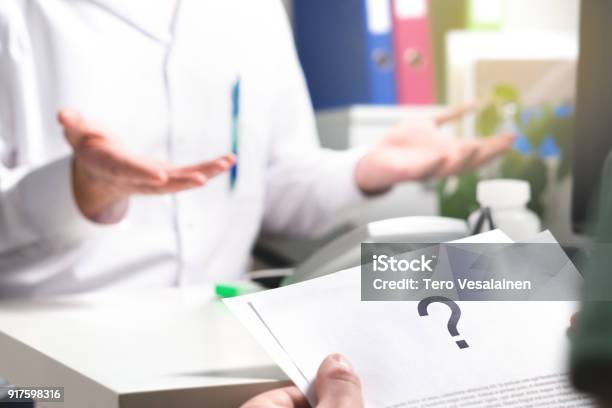 Medical Problem Patient Reading Health Care Document With Question Mark New Or Unknown Disease Cant Find Or No Cure For Illness Wrong Diagnosis Stock Photo - Download Image Now