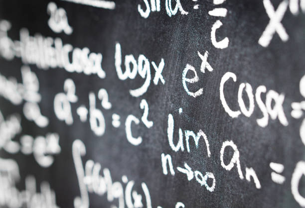 istock Close up of blackboard full of math equation, formula and numbers. Chalkboard in math or science class in school. 917599088