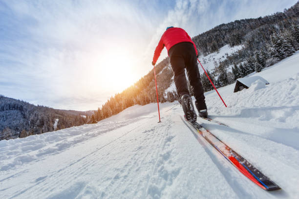 istock Cross-country skiing. Young man doing outdoor exercise. 917601896