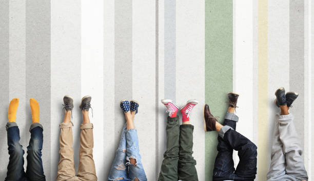 istock People's legs at the wall 917607082