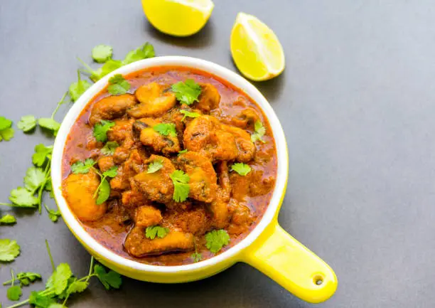 Spicy and delicious Indian mushroom curry image taken from above.
