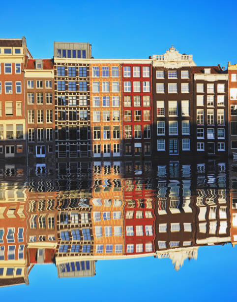 istock Typical Dutch houses built by the canal, Amsterdam, Netherland 917610898