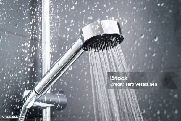 Fresh Shower Behind Wet Glass Window With Water Drops Splashing Stock Photo - Download Image Now