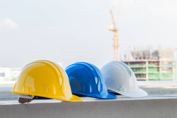 istock The safety helmet at construction site with crane background 917619200