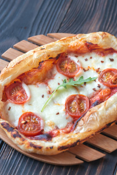 istock Mini pizza on the wooden board 917619266
