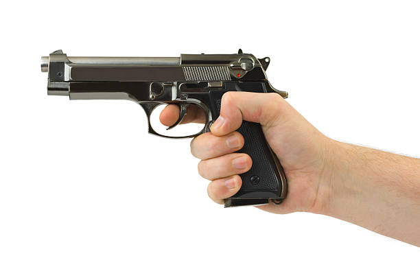 istock A person's hand holding a pistol on white background 91762107