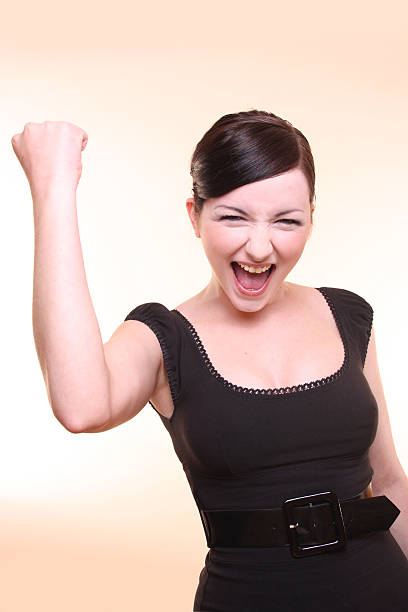 istock Young Woman celebrating on peach background 91762647