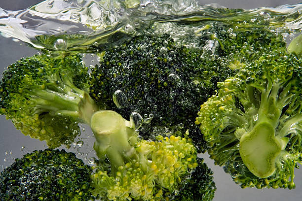 broccoli boiling in water  boiled water stock pictures, royalty-free photos & images