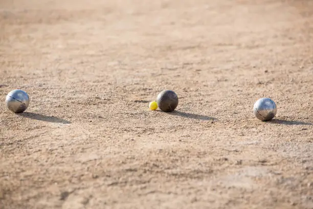 Photo of Friends Plays With Petanque Bowls A French Traditional Game