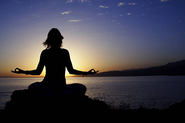 istock young women in lotus pose 91763227