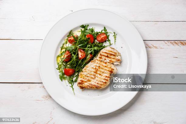 Roasted Grilled Chicken Breast And Fresh Salad Stock Photo - Download Image Now - Plate, Chicken Meat, Chicken Breast