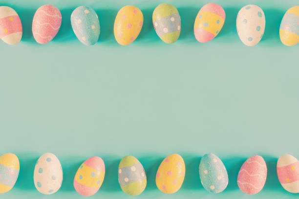 istock Colorful easter eggs on pastel color background with space. 917633842
