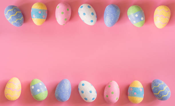 istock Colorful easter eggs on pink pastel color background with space. 917633936