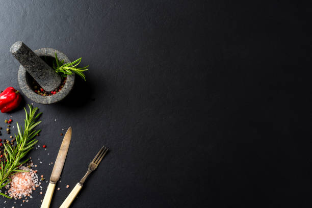 istock Food background with fresh herbs, spices and stone mortar 917637462