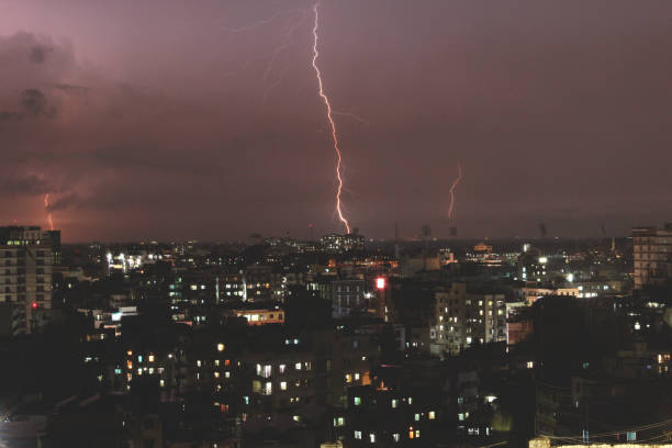 istock Dramatic thunderstorm above a city in rainy season at night 917638128