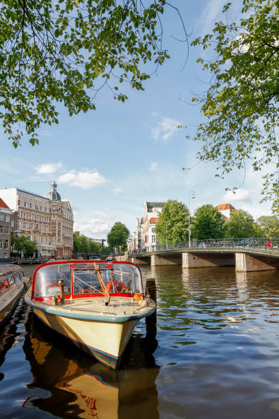 istock Tour Boats Docked, Amsterdam, Netherlands 917638628