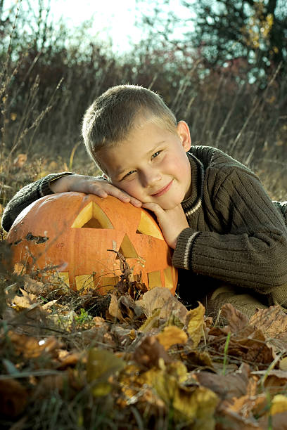 istock Smiling Little boy with pumpkin 91764039