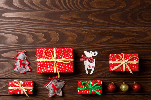 istock Christmas background with colorful decorations on an old wooden table 917641228
