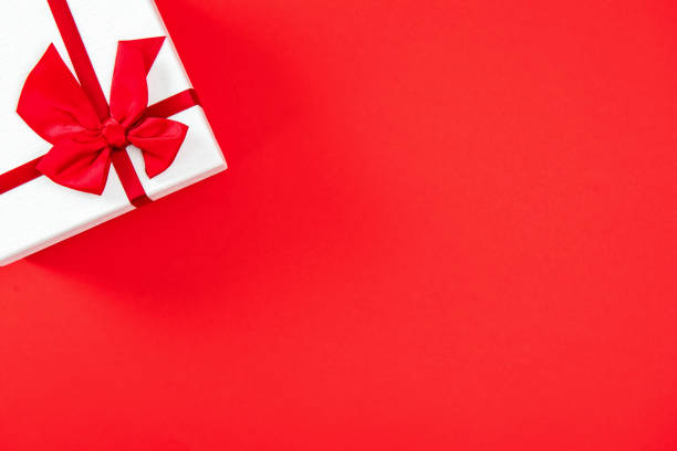 istock Valentine's day or wedding gift box on red background 917641468
