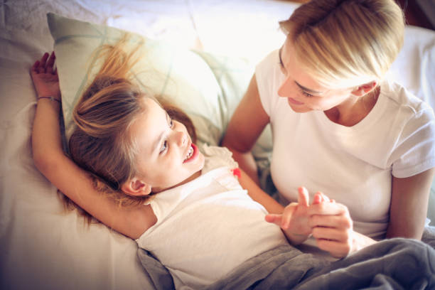 istock mother and daughter at morning. 917641548