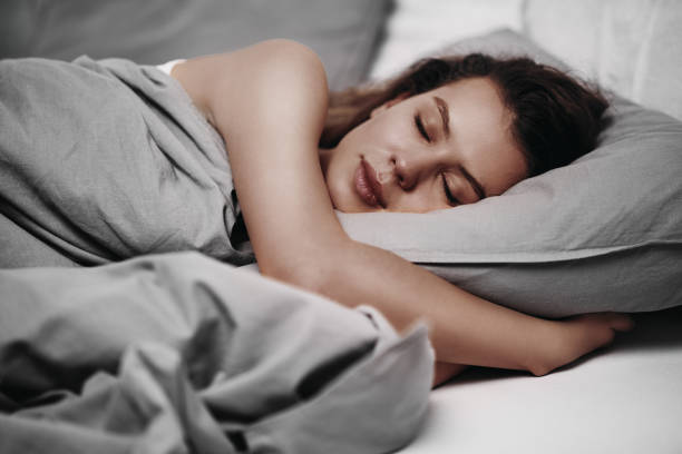 istock Girl lying down on bed in the morning 917641666