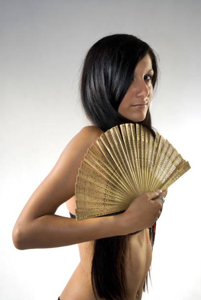 Girl with fan stock photo