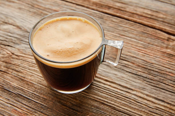 istock Coffee glass cup on wooden table 917645754