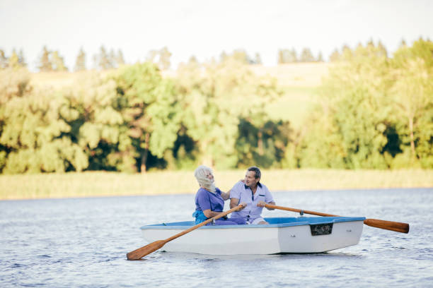 istock Older couple swimming on a lake 917646602