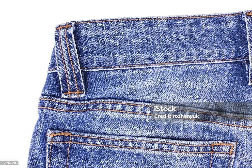 Jeans blu su bianco - Foto stock royalty-free di Abbigliamento