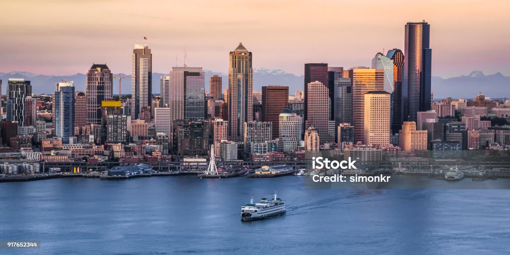 Exterior of modern cityscape View of crowded modern cityscape with 1201 Third Avenue, U.S. Bank Centre, ship moving in foreground, Seattle, Washington, United States. Seattle Stock Photo