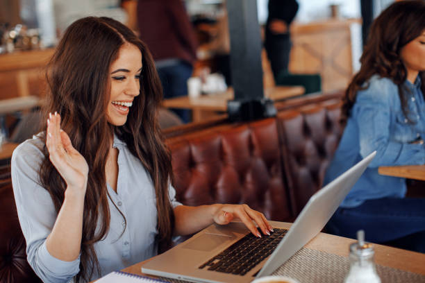 istock Young woman making video call in cafe 917653464