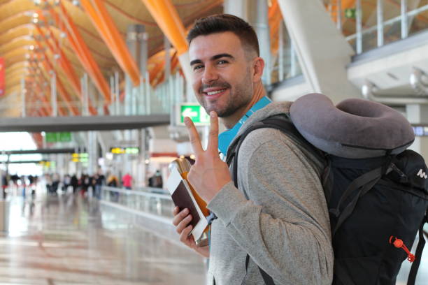 istock Satisfied traveler giving a peace sign 917656266