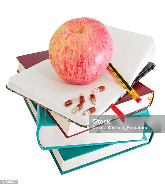 Apple And Pills On Big Pile Of Books Stock Photo - Download Image Now - Apple - Fruit, Arrangement, Book