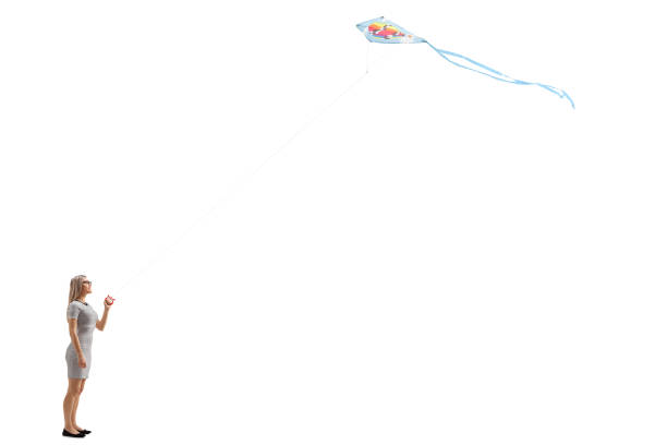 istock Young woman flying a kite 917656860