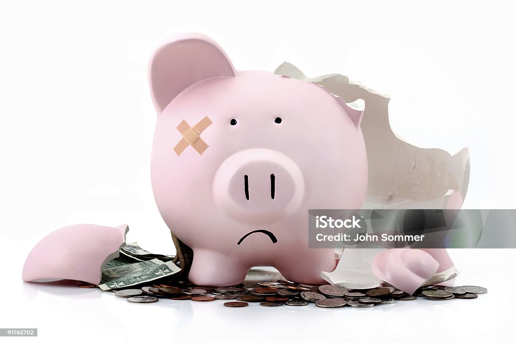 Broken piggy bank Broken piggy bank to represent bad economy or investments  Piggy Bank Stock Photo