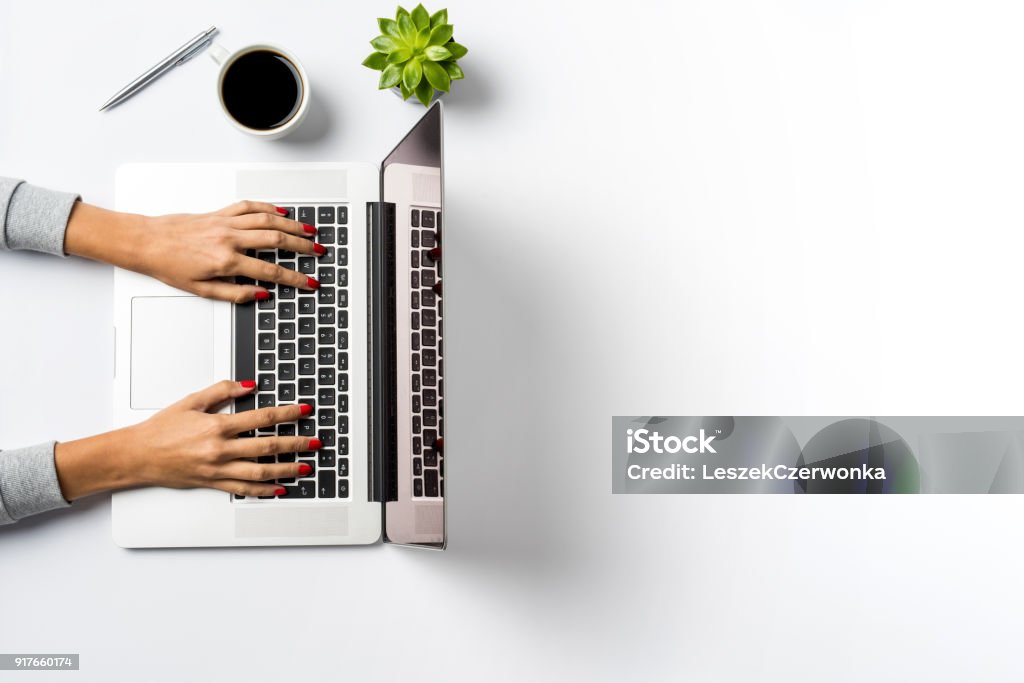 Woman working on laptop Hand Stock Photo