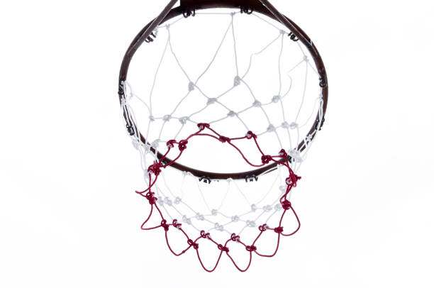 istock Basketball hoop viewed from below on white 917660332