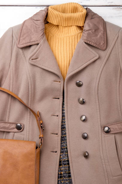 istock Female overcoat, sweater and handbag. 917660908