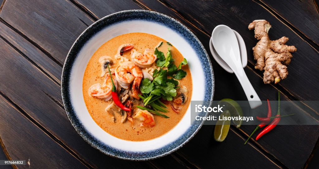 Tom Yam kung Spicy Thai soup Tom Yam kung Spicy Thai soup with shrimp, seafood, coconut milk and chili pepper in bowl Thai Food Stock Photo