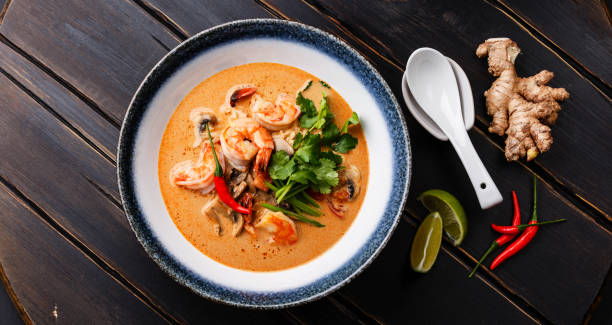 Tom Yam kung Spicy Thai soup Tom Yam kung Spicy Thai soup with shrimp, seafood, coconut milk and chili pepper in bowl thai food stock pictures, royalty-free photos & images