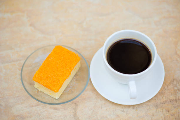 istock A cup of coffee and golden threads cake 917665134