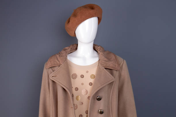 istock Female mannequin in top coat and beret. 917668162