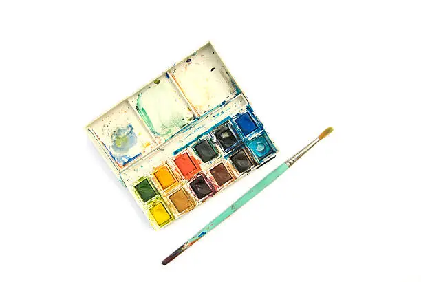 Photo of Messy paintbox and brush