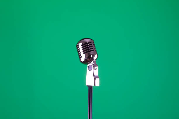 istock vintage microphone on a green isolated background 917675122